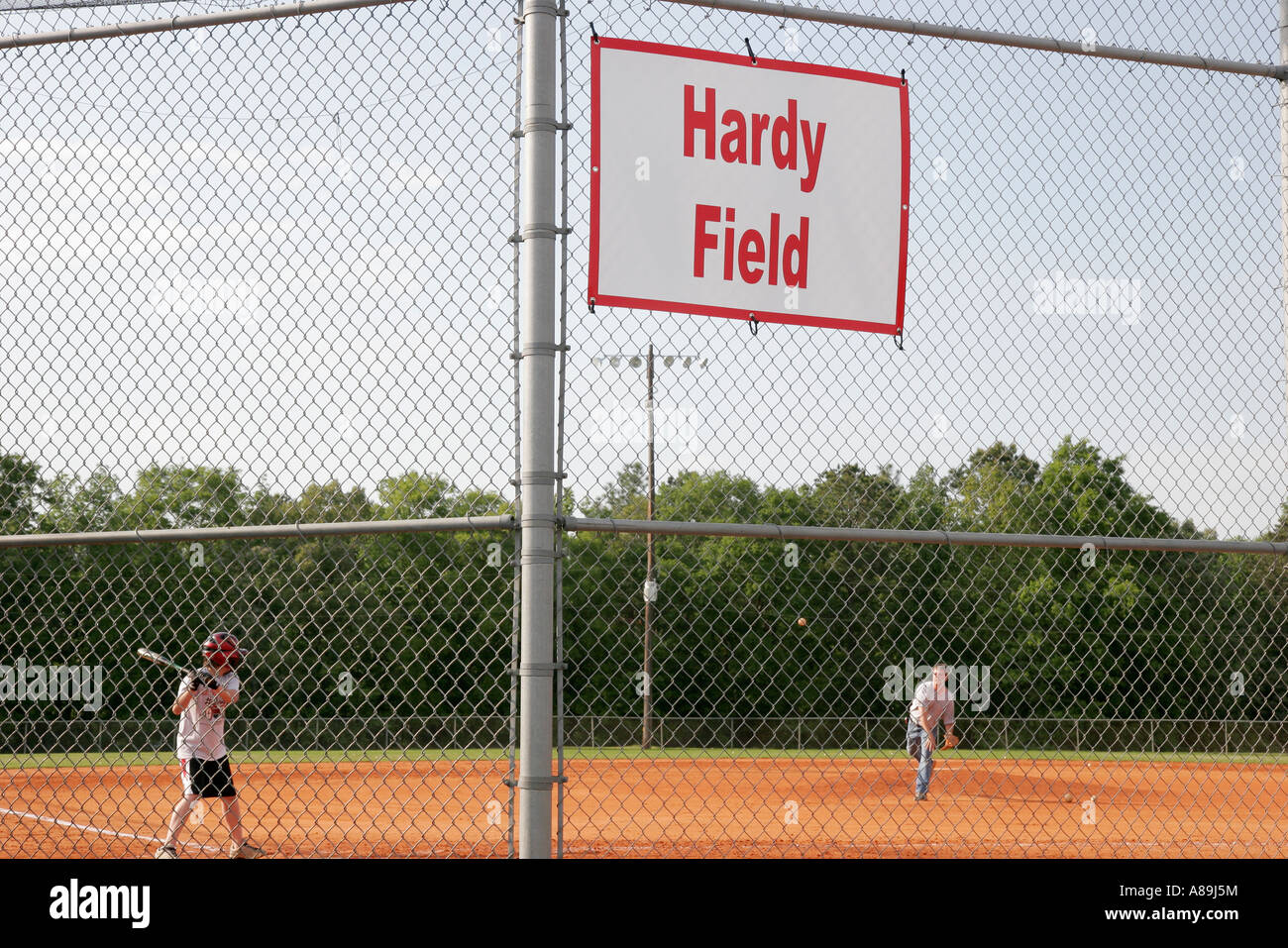 Dothan Alabama,Westgate Park Baseball,Hardy Field,father pitches,son hits,bat,backstop,practice
