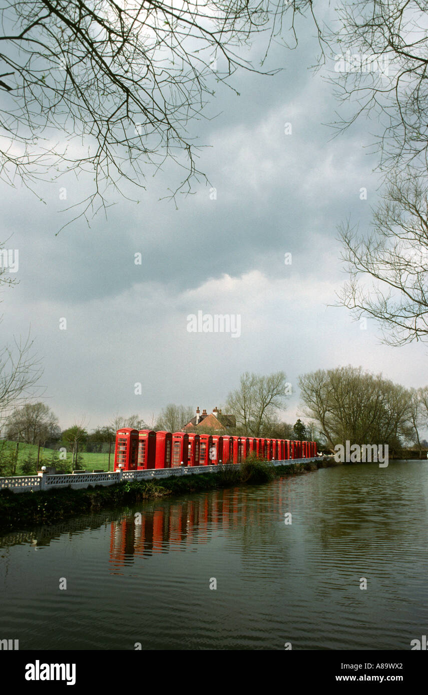 Oxfordshire Wantage row of 26 recycled K6 K8 phone boxes in private drive Stock Photo