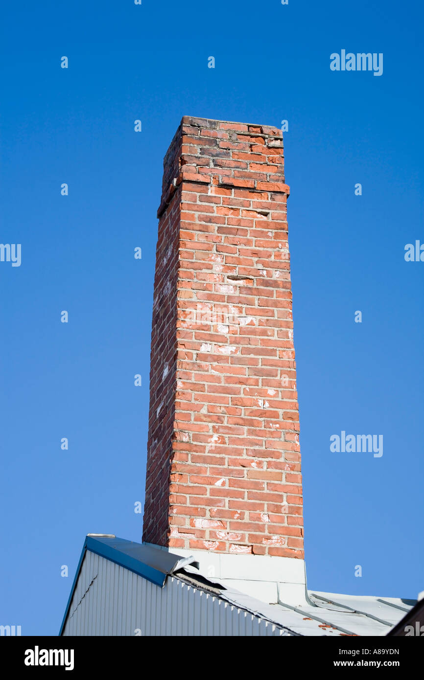 Chimney against blue sky Stock Photo - Alamy