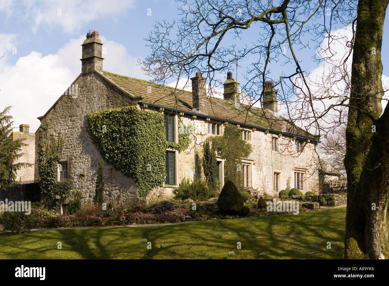 UK Yorkshire Wharfedale Linton village stone cottage beside Linton Beck