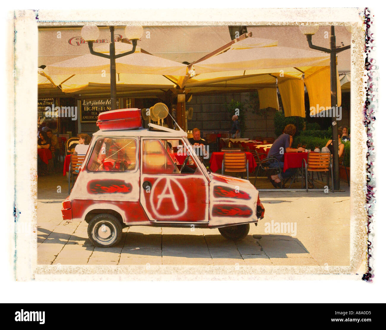Painted three wheel car in Florence Italy Stock Photo