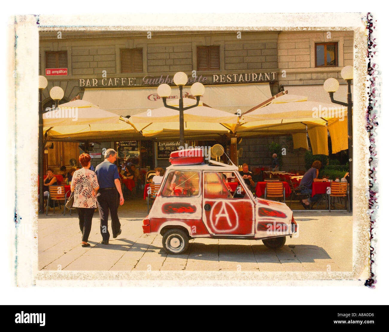 Painted three wheel car in Florence Italy Stock Photo