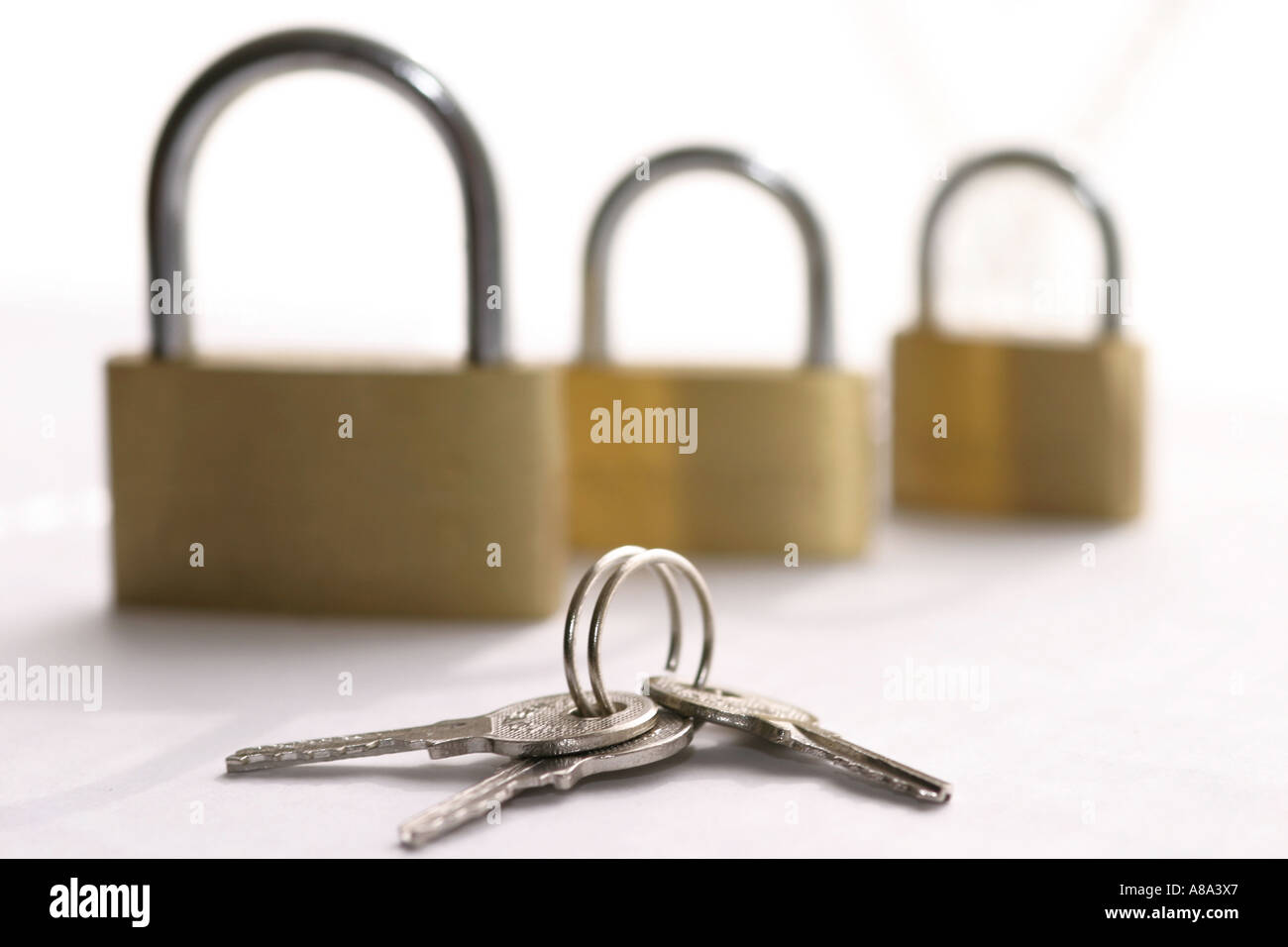 Locks and keys on white background Stock Photo
