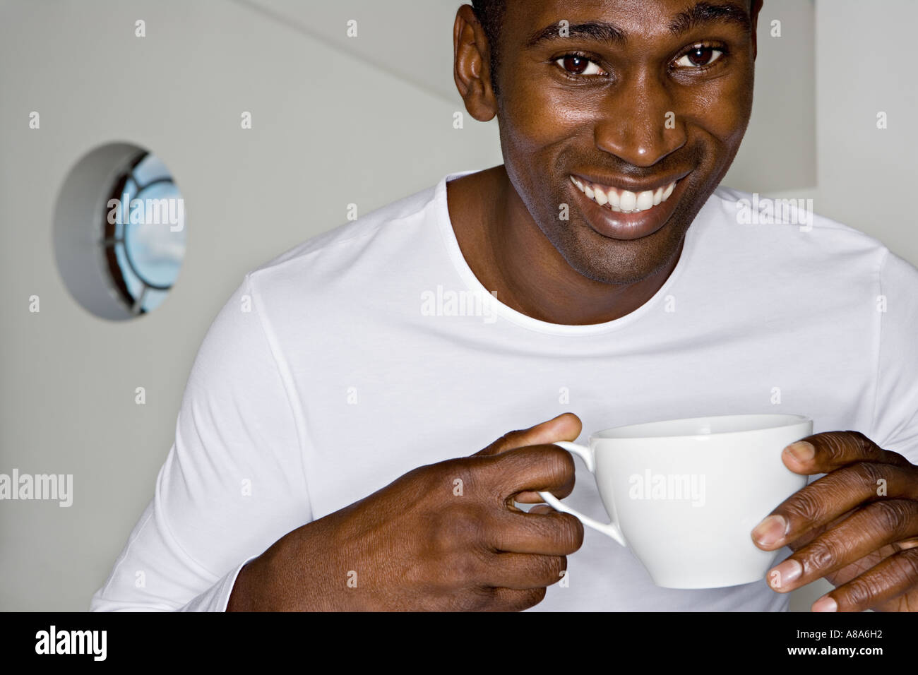 Happy man with teacup Stock Photo Alamy