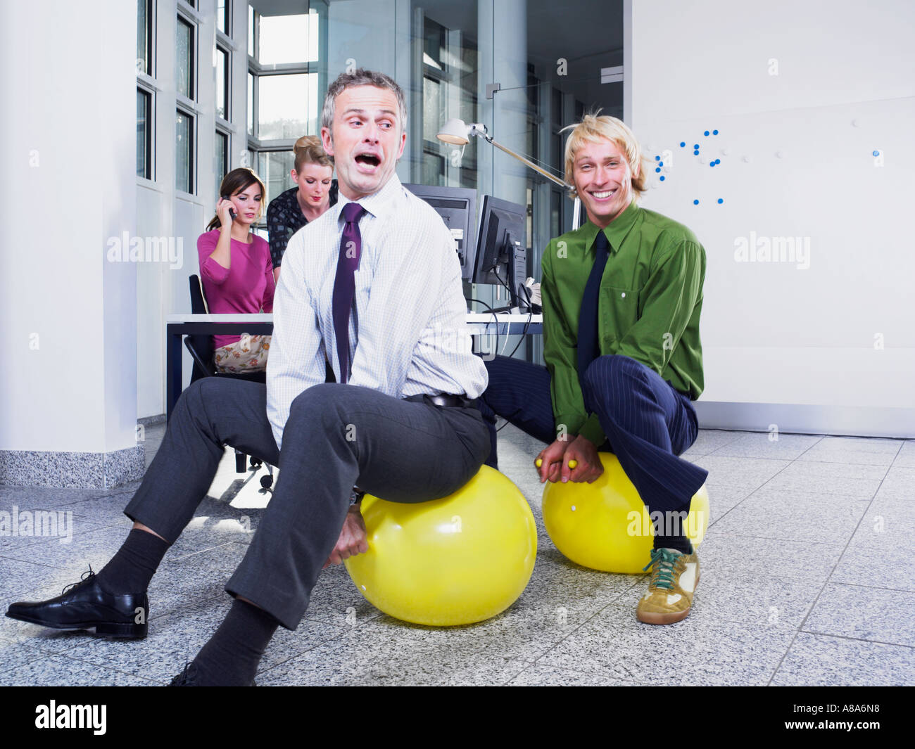 Office workers on hoppers Stock Photo Alamy