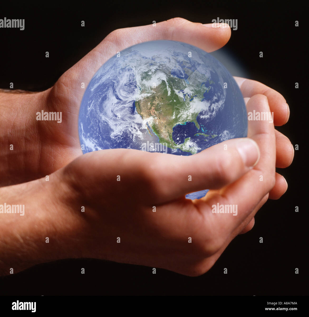 Person holding planet earth Stock Photo