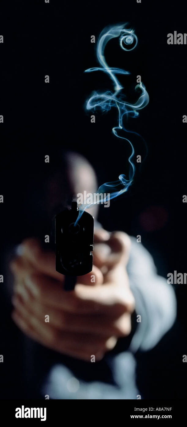 Gun Pound Sign Person holding gun violence sign hi-res stock photography and images ...