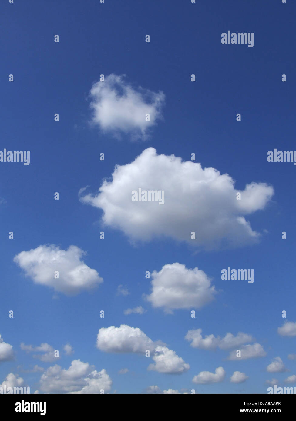 dramatic fluffy white clouds and blue sky Stock Photo - Alamy