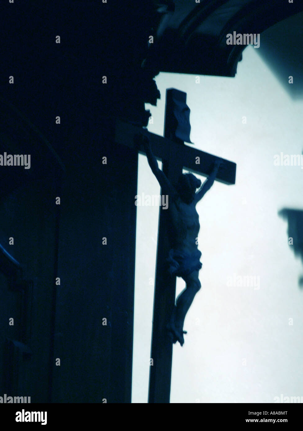 jesus on cross in church in italy Stock Photo - Alamy