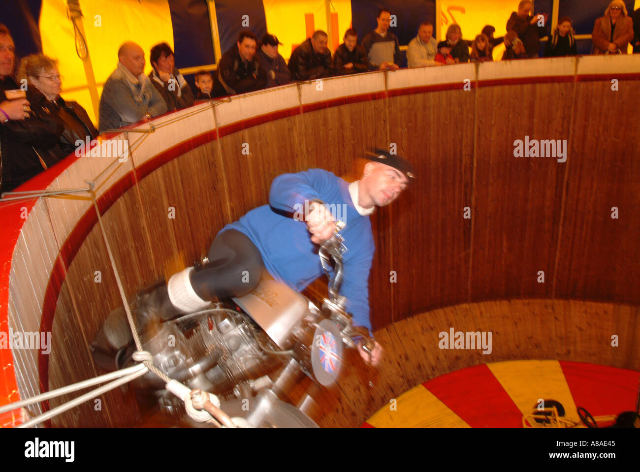 wall of death circus act round in circles danger motor bike motorbike cycle motorcycle death defying disorganised chasing your o Stock Photo