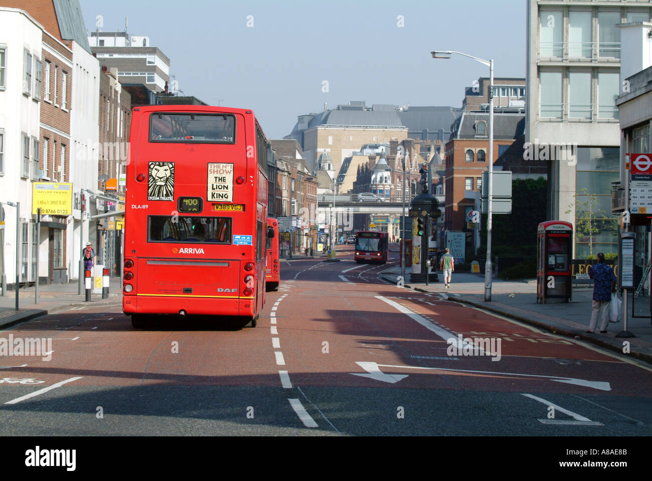 red bus on croydon high street bus stop taxi rank mass transport public
