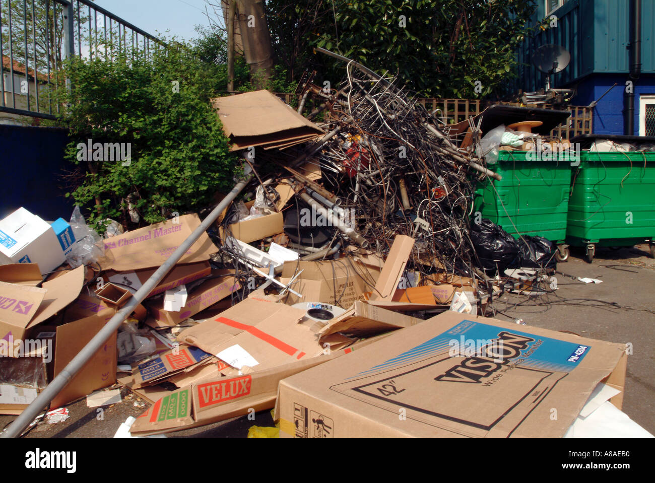 junk trash old ariel TV satelite dish cardboard fire hazard Stock Photo