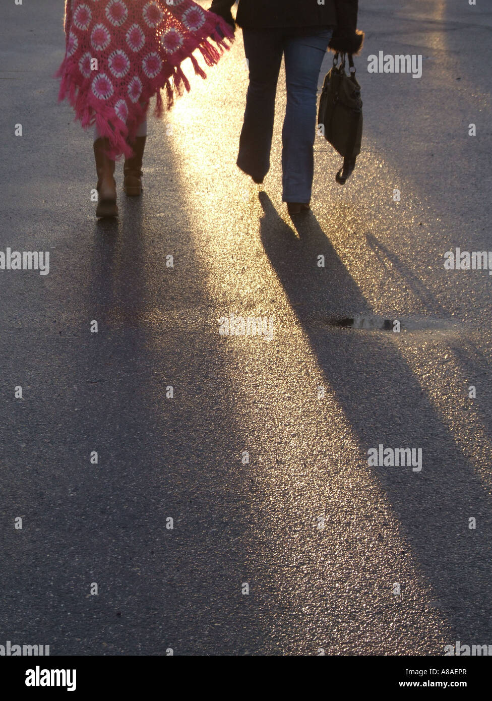 Two girls walking dark hi-res stock photography and images - Alamy