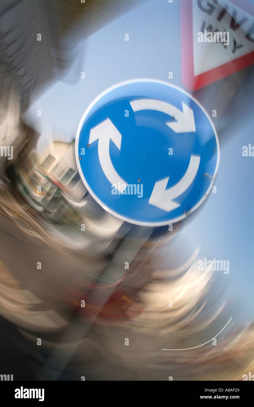 recycle, recycling, reuse, roundabout road sign motion blur concept road safety round in circles spin turn 360 degrees rotate Stock Photo