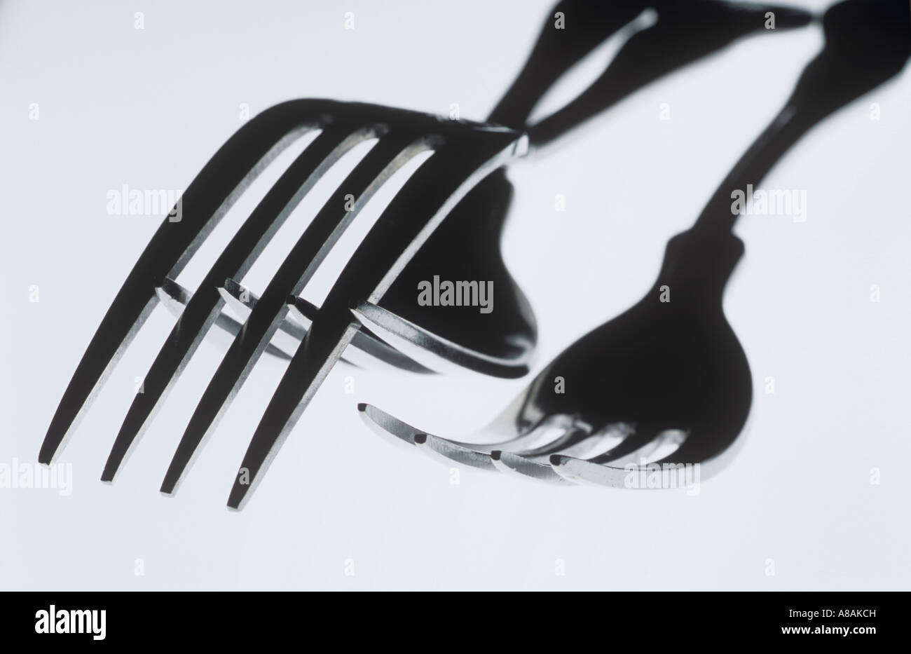Forks in mid air Stock Photo Alamy