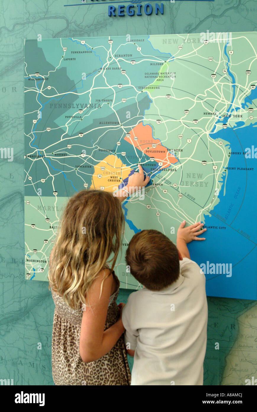 Kids looking at a map of Greater Philadelphia, Pennsylvania USA PA Stock Photo