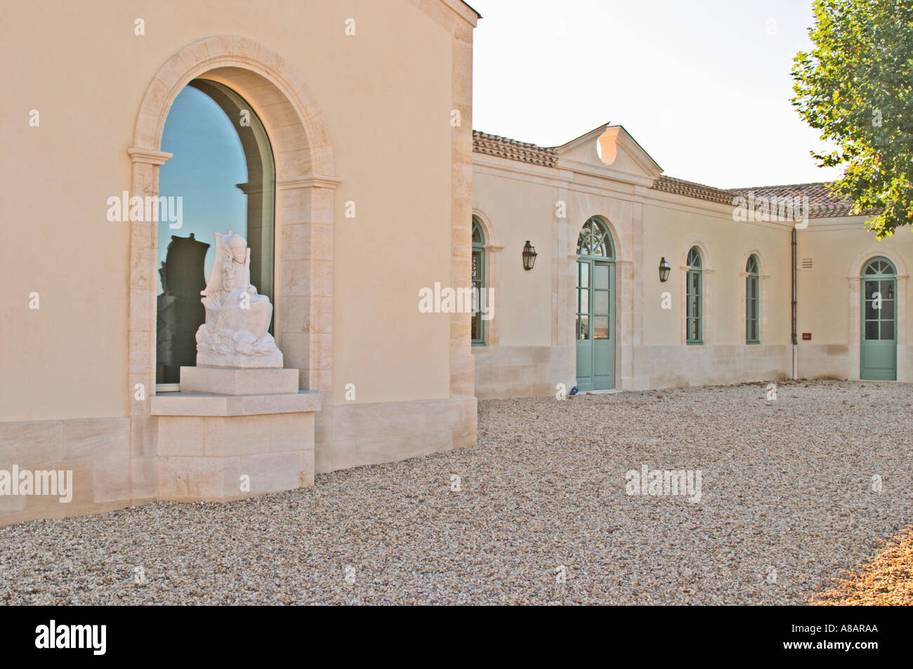 Chateau Petrus, the newly renovated wine cellar, winery, and the statue of Saint Peter, owned by