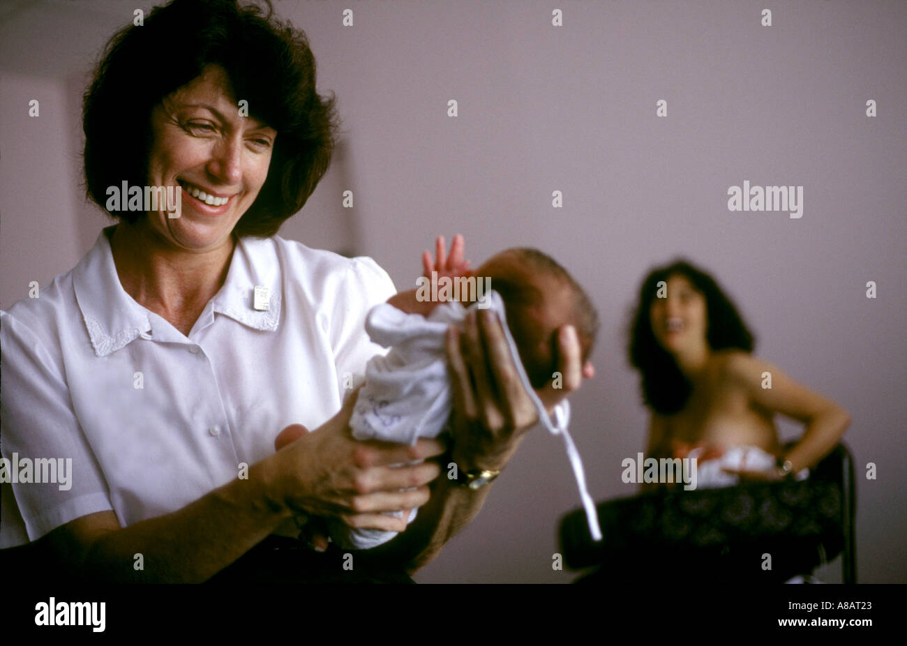 Nurse caring newborn child hi-res stock photography and images - Alamy