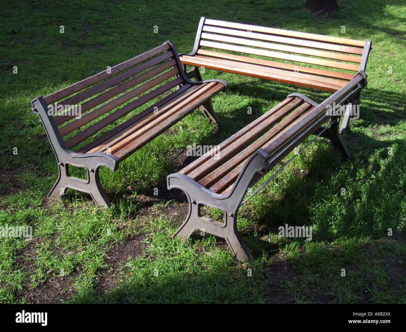 three benches in park Stock Photo - Alamy