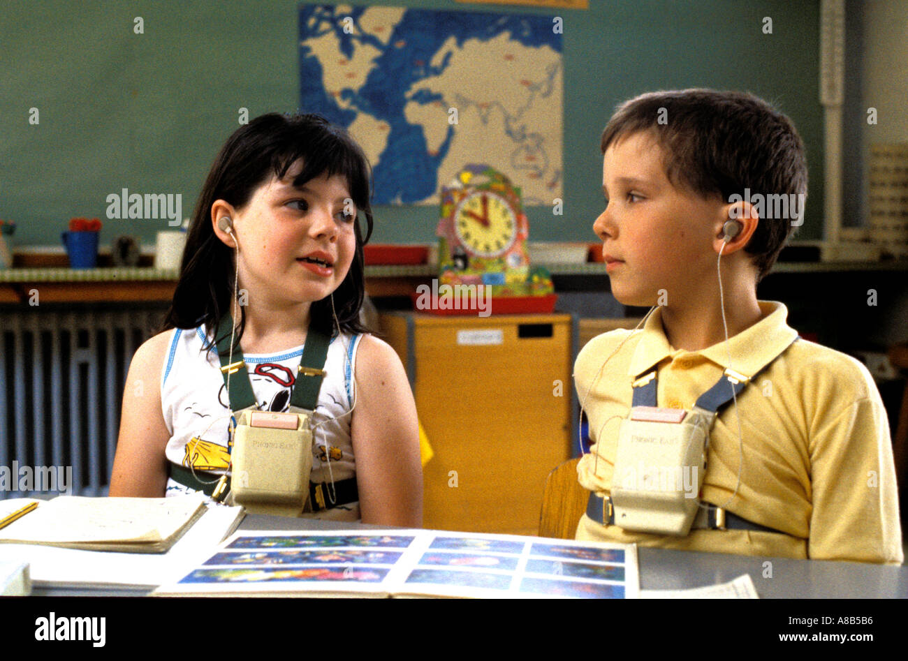 Deaf children using radiophonic aids in classroom Stock Photo Alamy