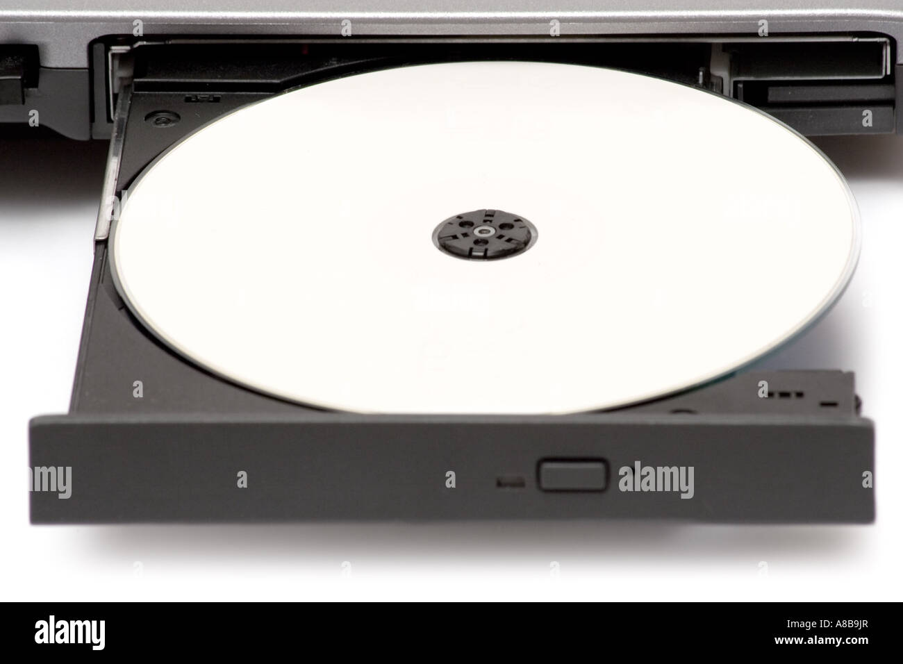 Blank CD in a notebook drive White background  Stock Photo