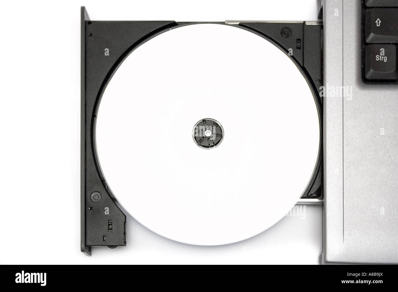 Top view on a blank CD in a notebook drive White background  Stock Photo