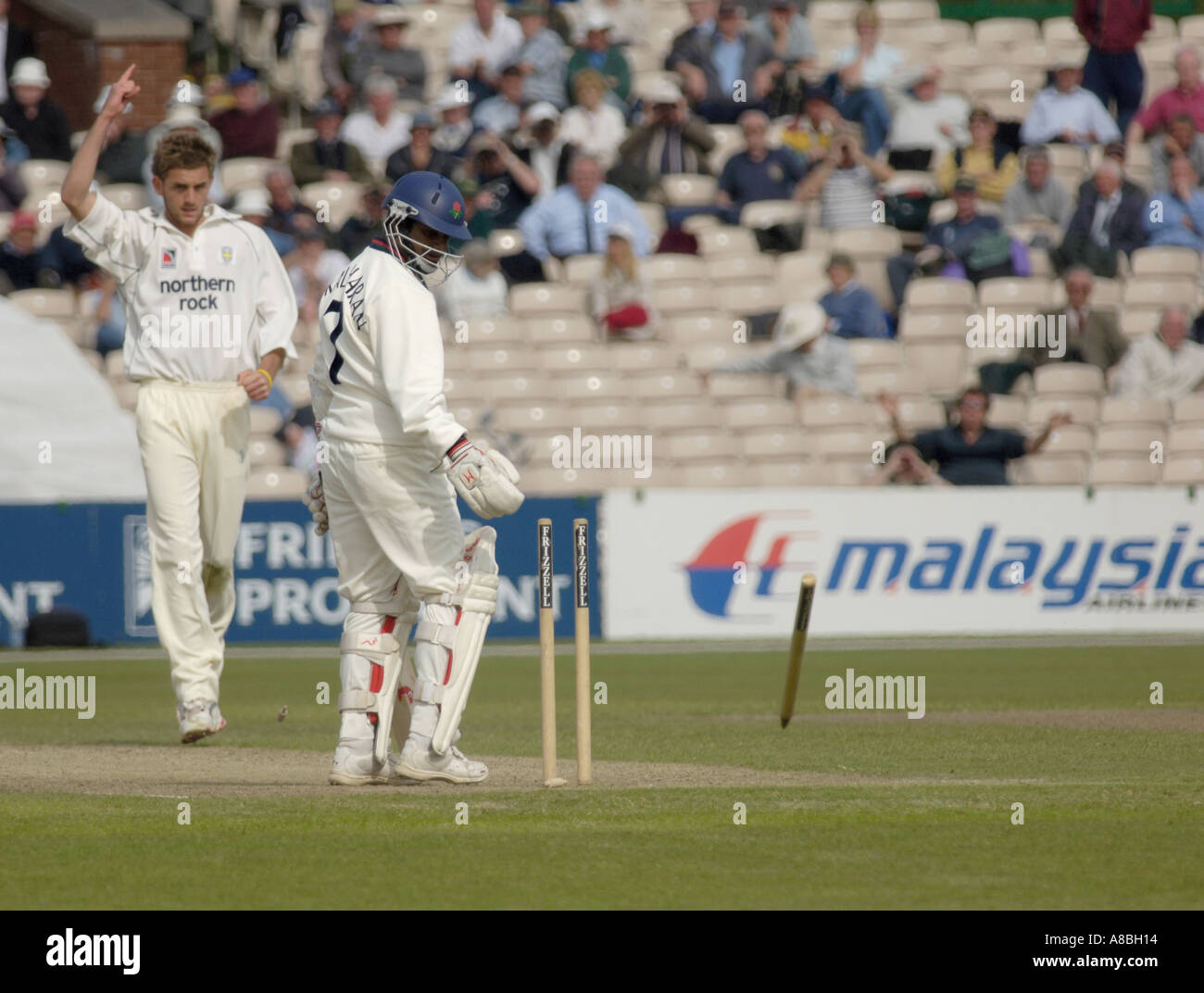 Liam Plunkett of durham bowls out muttiah muralitharan of lancashire Stock Photo