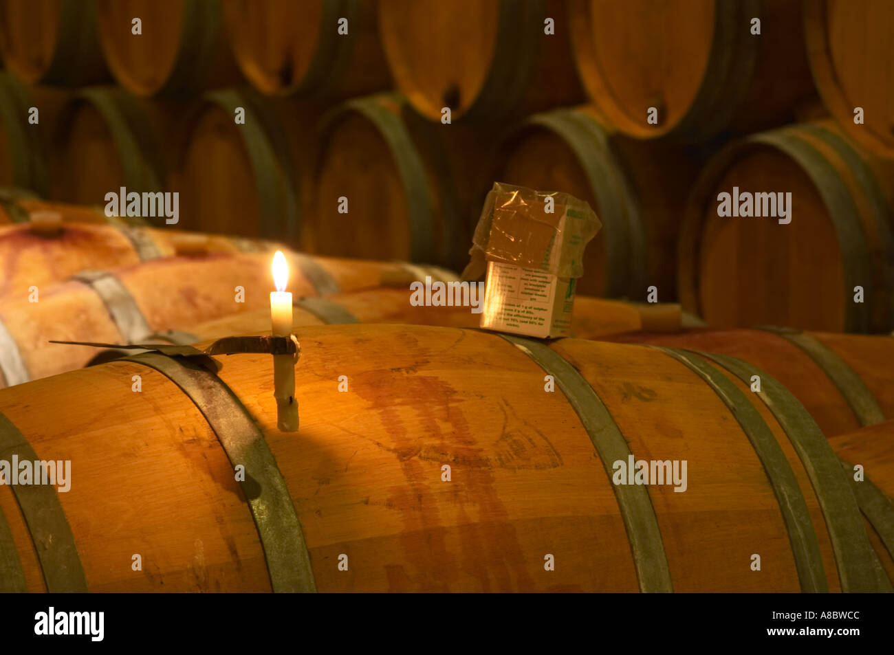 The winery, barrel aging cellar a burning candle, a box of sulphur