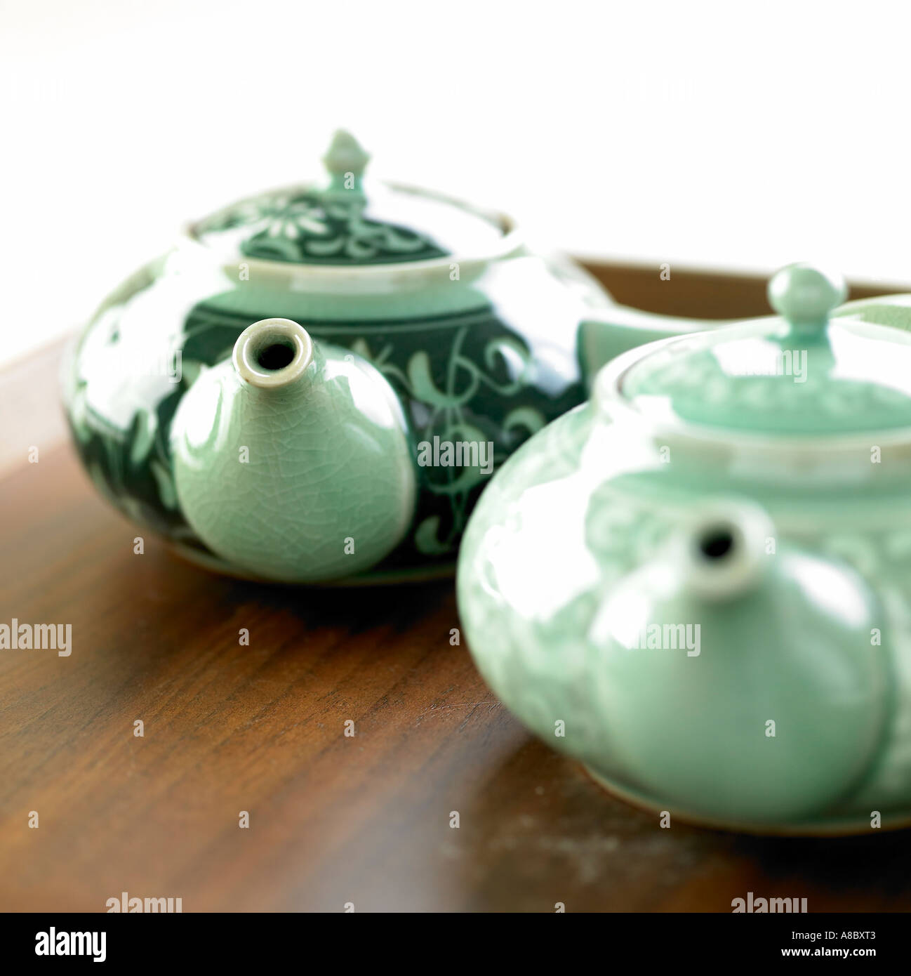 Pattern engraved on the blue teapots Stock Photo Alamy