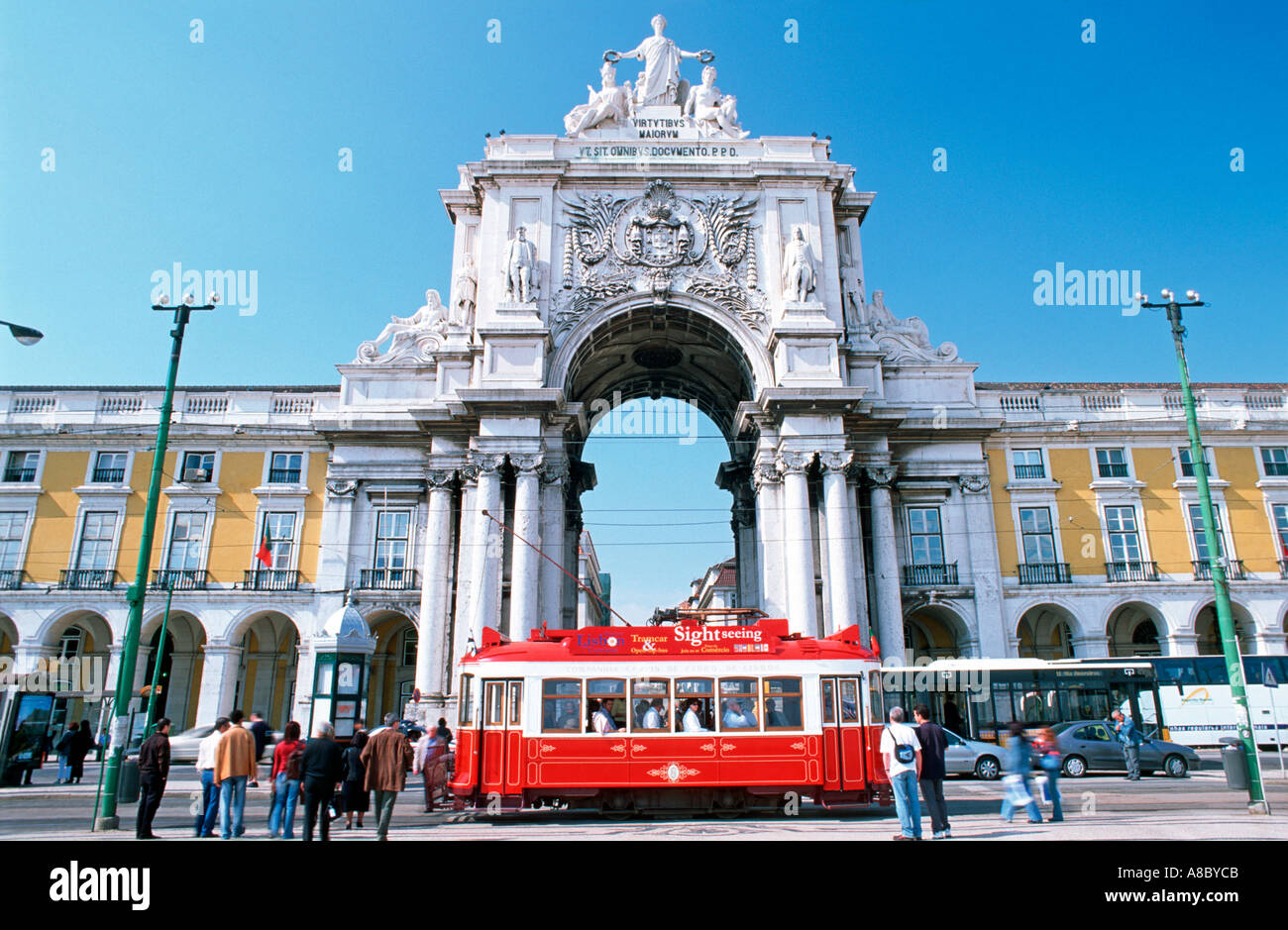 Historical tram passing at Triumph Arch Comercial Square Lisbon Europe Stock Photo