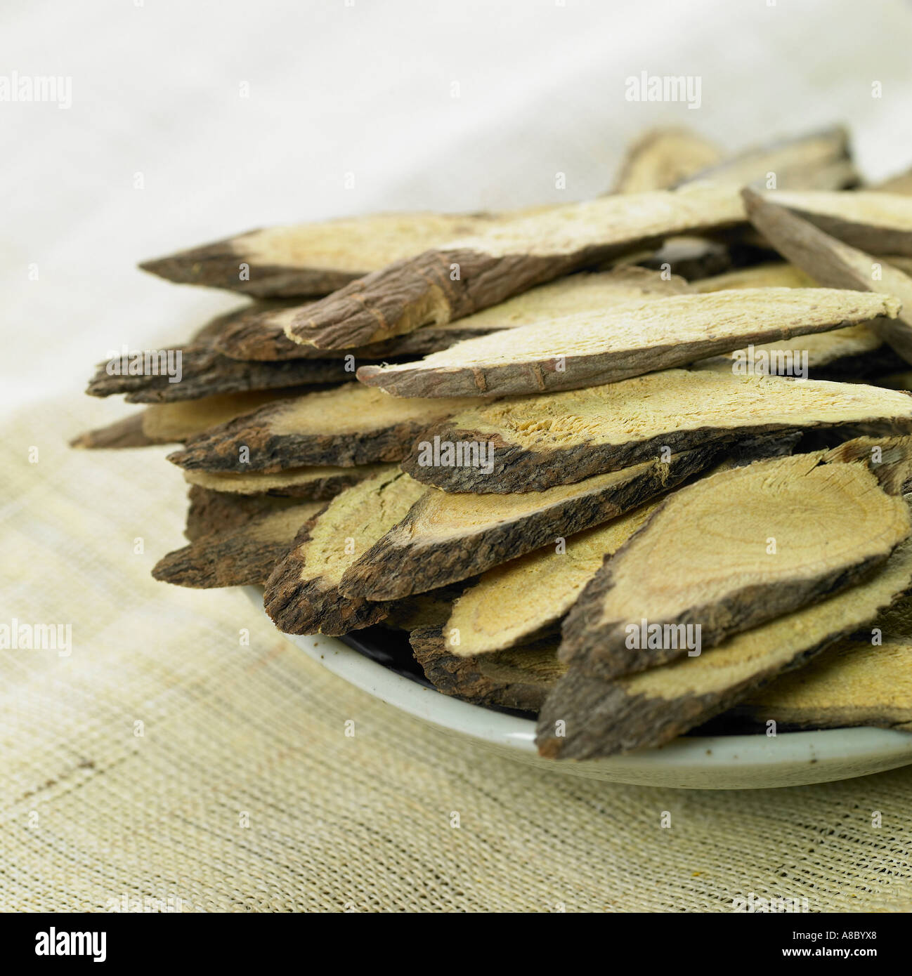 Chinese medicine licorice root on the plate Stock Photo Alamy