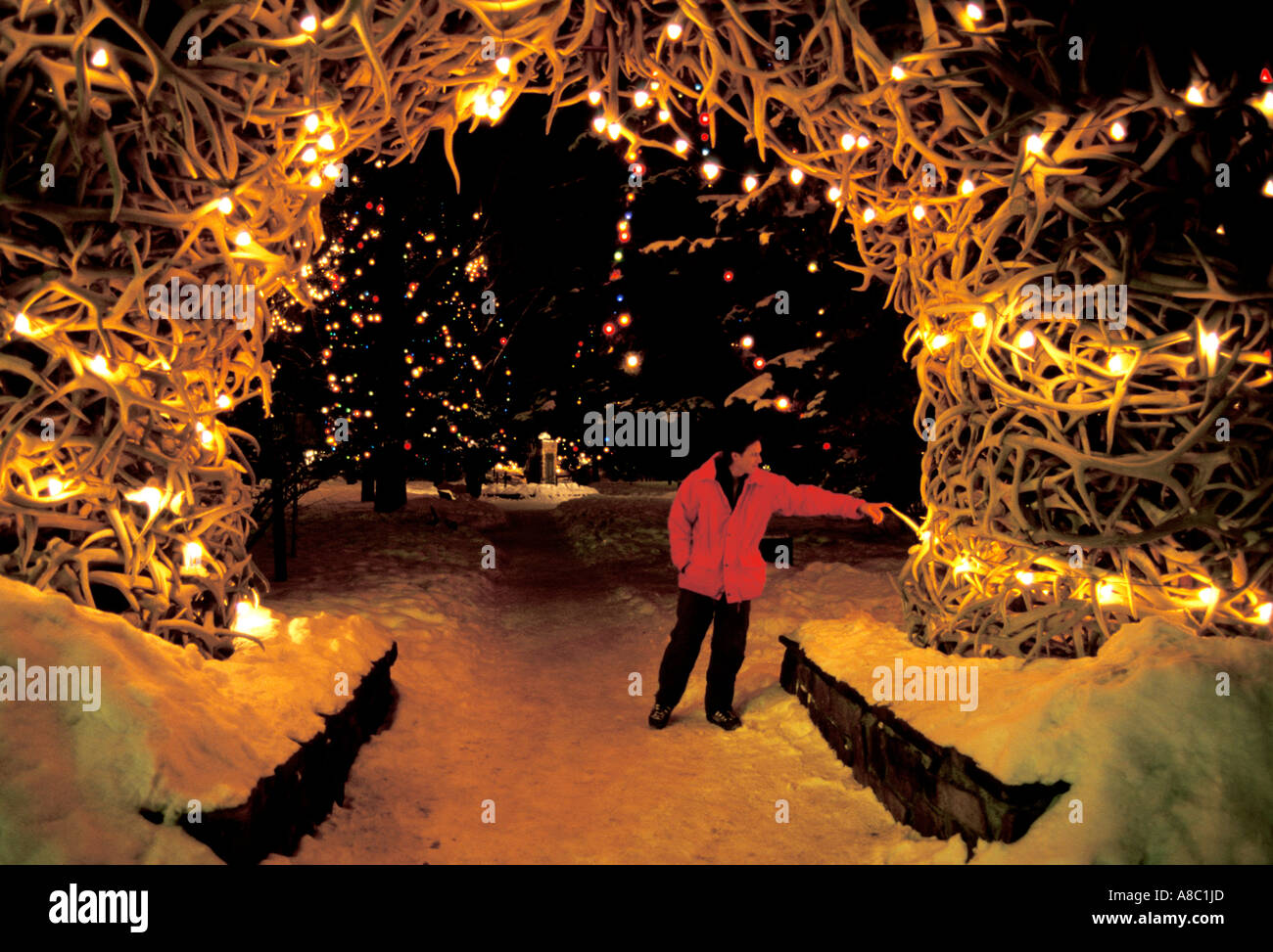 Wyoming Jackson Hole elk antlers in town square winter at night Stock Photo