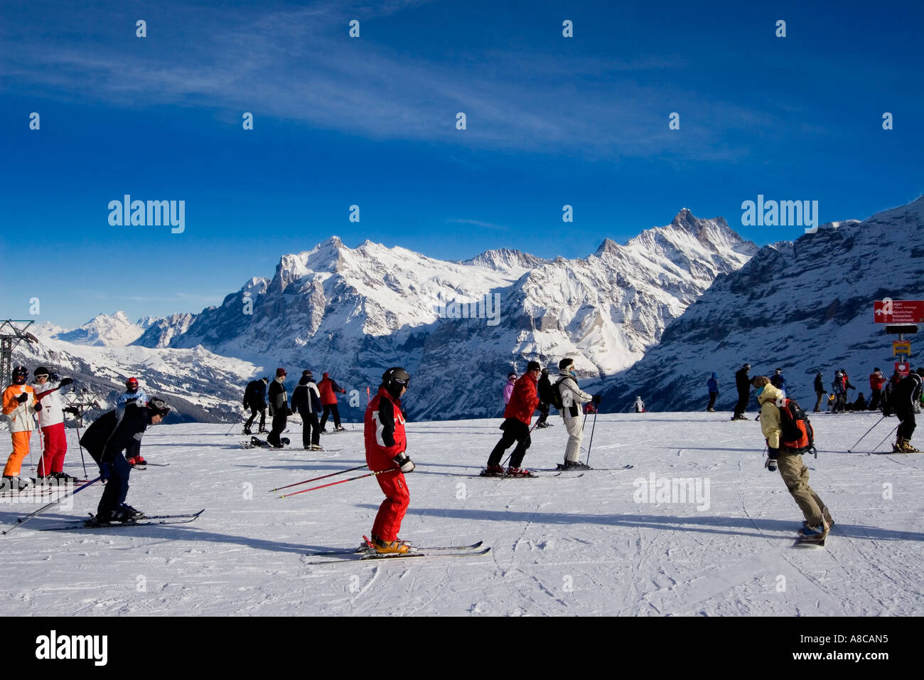 Switzerland bernese alps Mount Maennlichen skiing and snowboarding piste beautifil panoramic view to Mount Eiger Moench Jungfrau Stock Photo