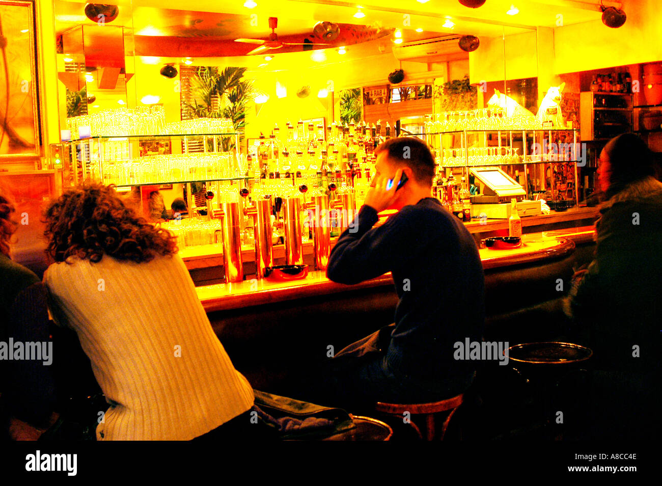 Gay Bar, PARIS France, 'L'Amnesia Cafe' in Le Marais Area  People, Man inside Cellphone Trendy Bar Pub (now closed) talking on phone, drink alcohol Stock Photo