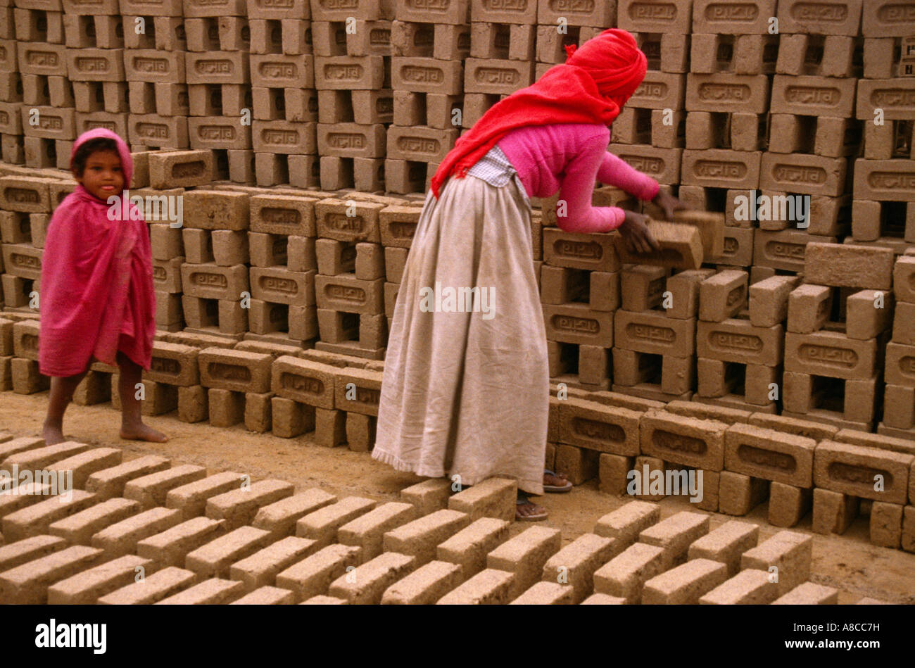 Rajasthan India Brickworks  Mother & Child Making Bricks Stock Photo