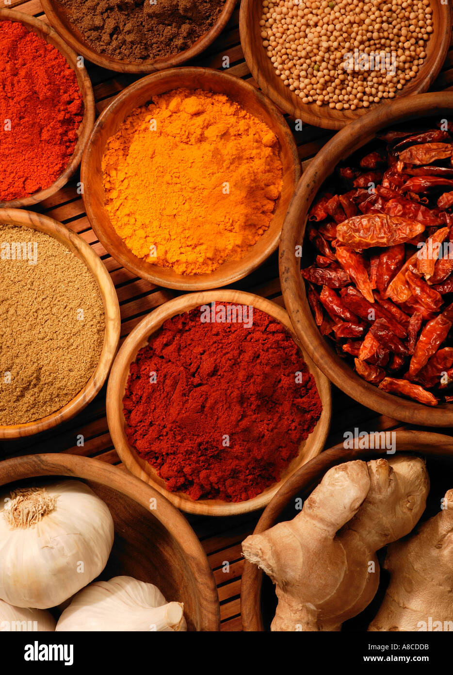 ASSORTED SELECTION OF SPICES IN WOODEN BOWLS Stock Photo Alamy