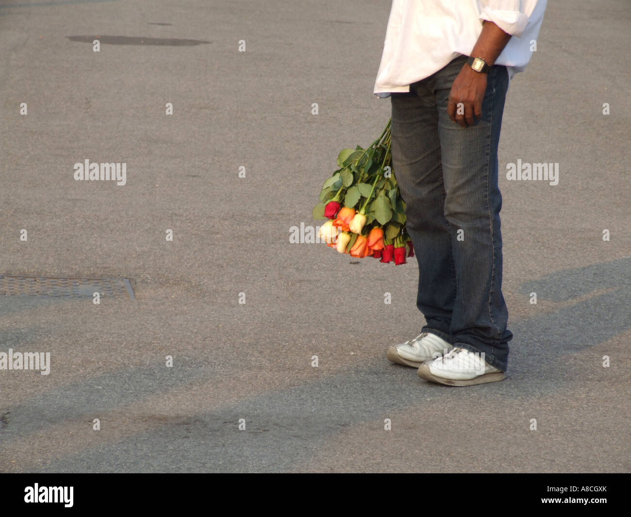 man holding bunch of roses in rome Stock Photo - Alamy