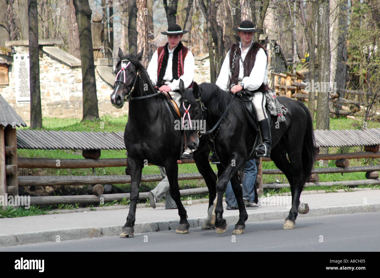 Polish highlanders wearing traditional clothes riding horses in Zakopane Stock Photo