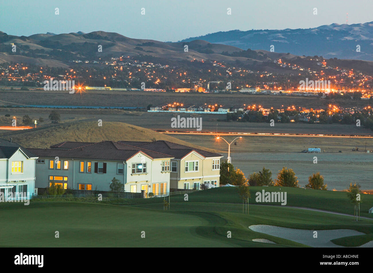 Suburban homes near golf course at twilight Pleasanton California United States Stock Photo