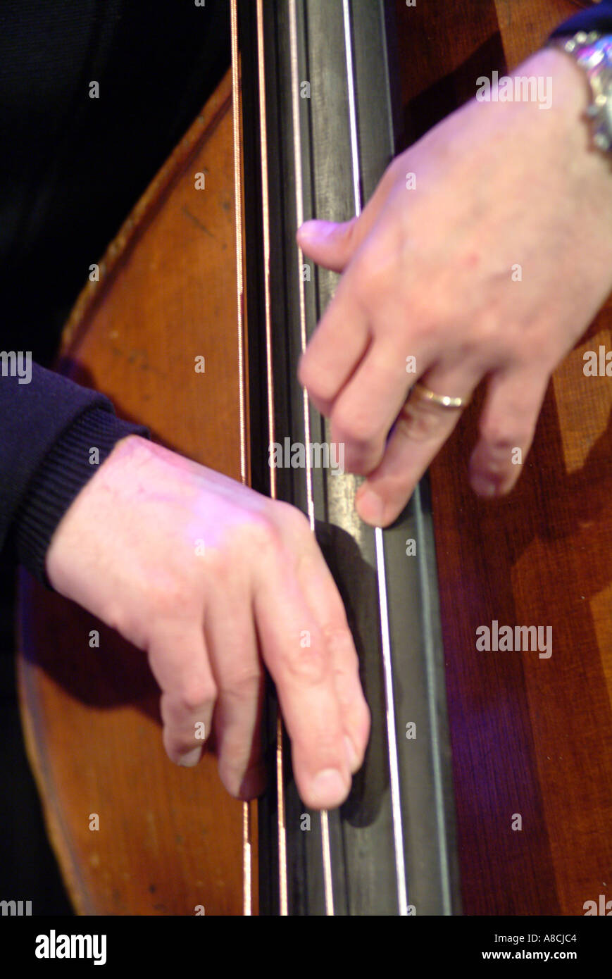 Close-up of musician playing pizzicato on Double Bass Stock Photo