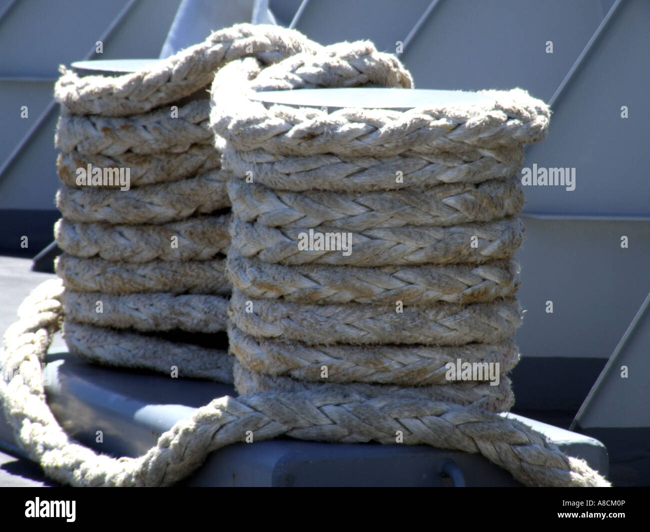 coiled rope on quayside Stock Photo - Alamy