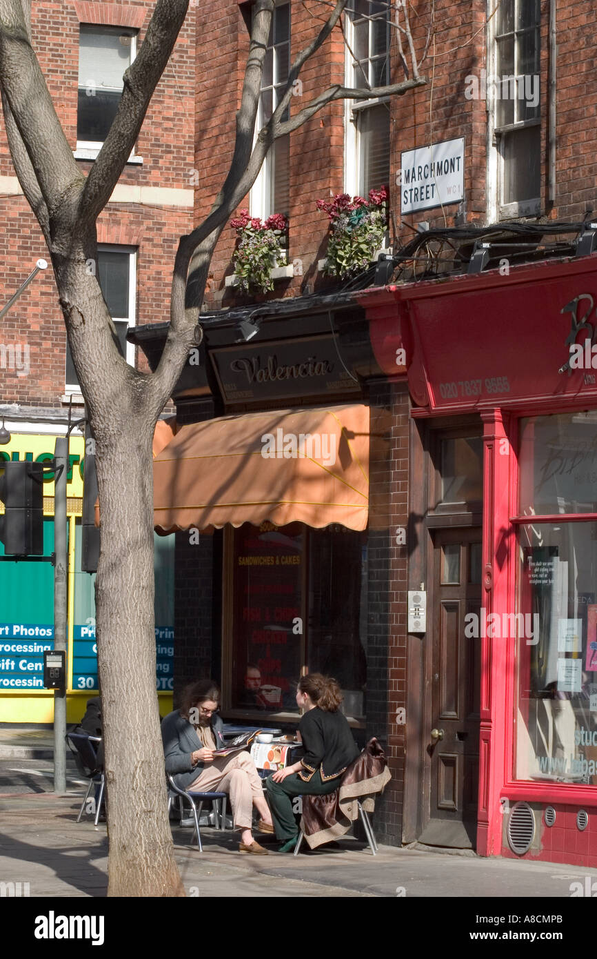 Couple having coffee at pavement cafe. Cafe Valencia, Marchmont Street, Bloomsbury, London, England Stock Photo