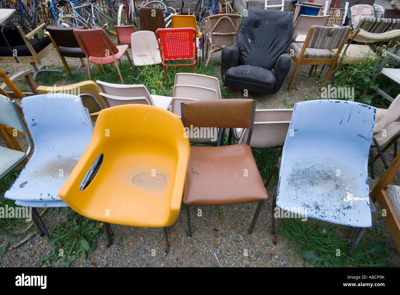A collection of old chairs at a recycling depot Stock Photo Alamy