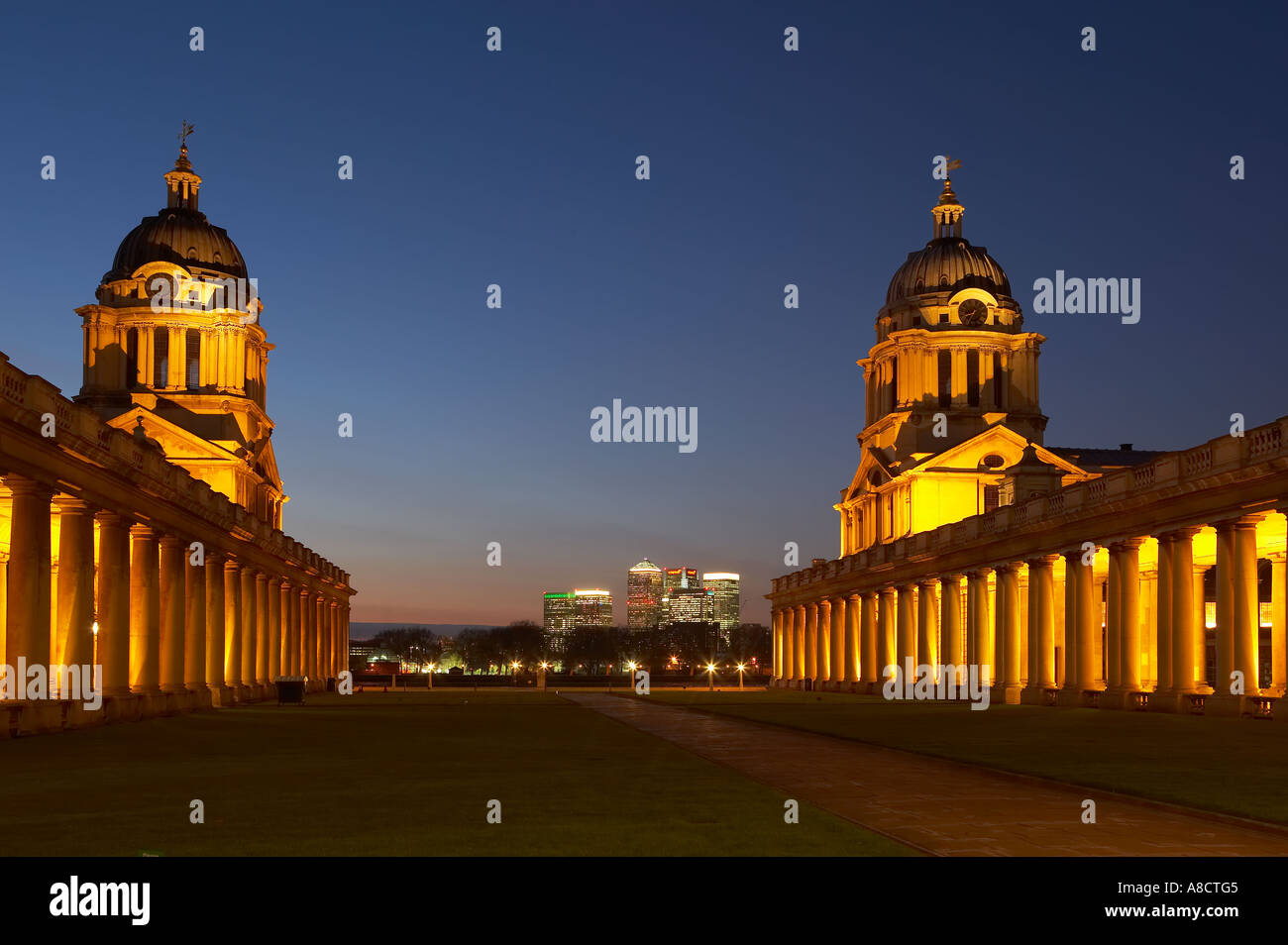the Old Royal Naval College and the skyline of Canary Wharf Greenwich London England UK Stock Photo