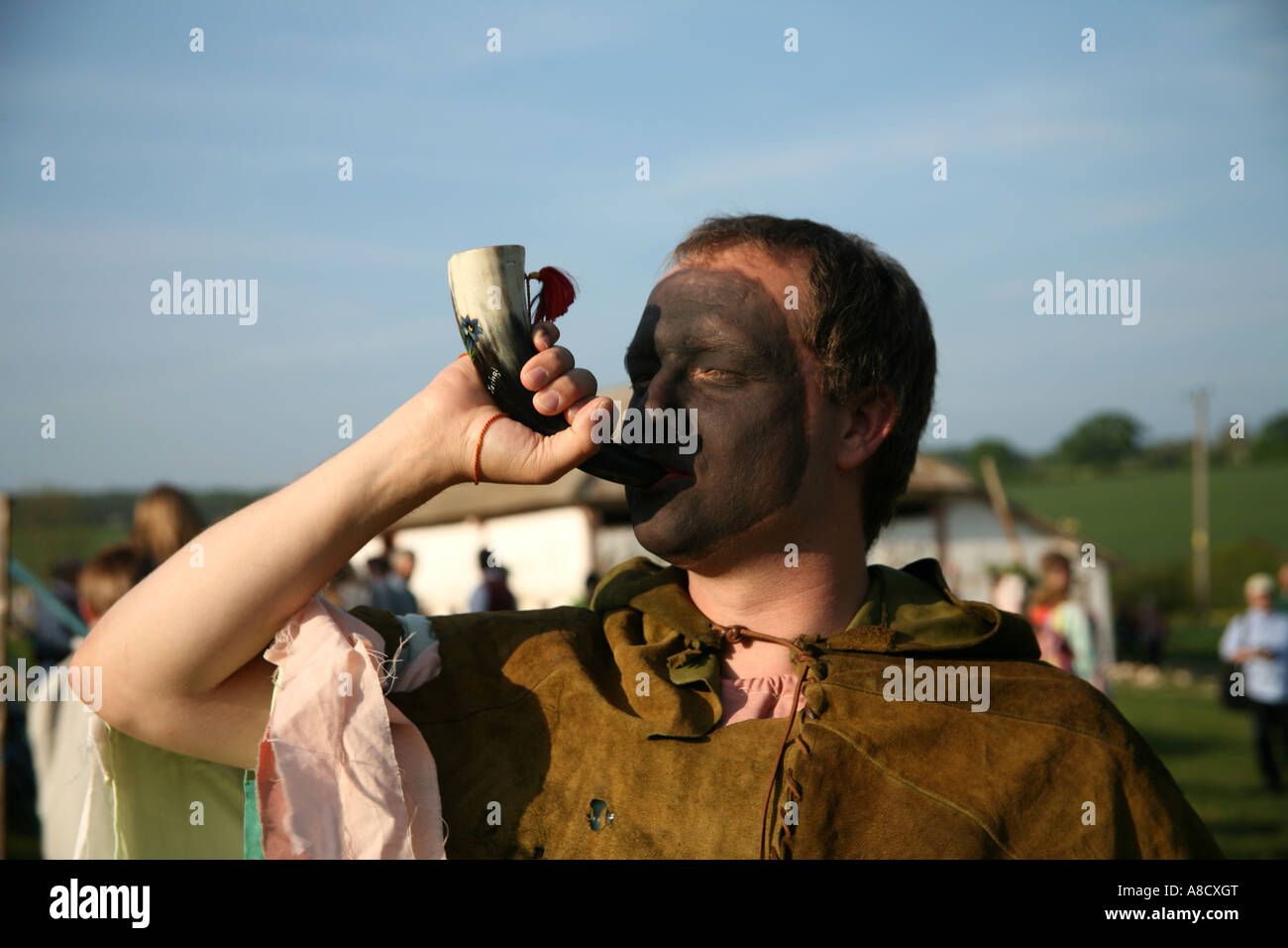 A pagan announcing the start of a play at Butser Farm Stock Photo