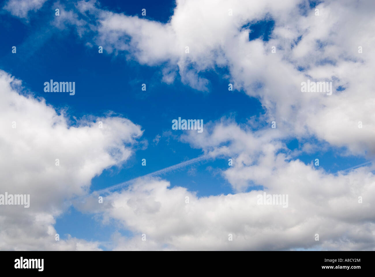 White clouds against a blue sky Stock Photo - Alamy
