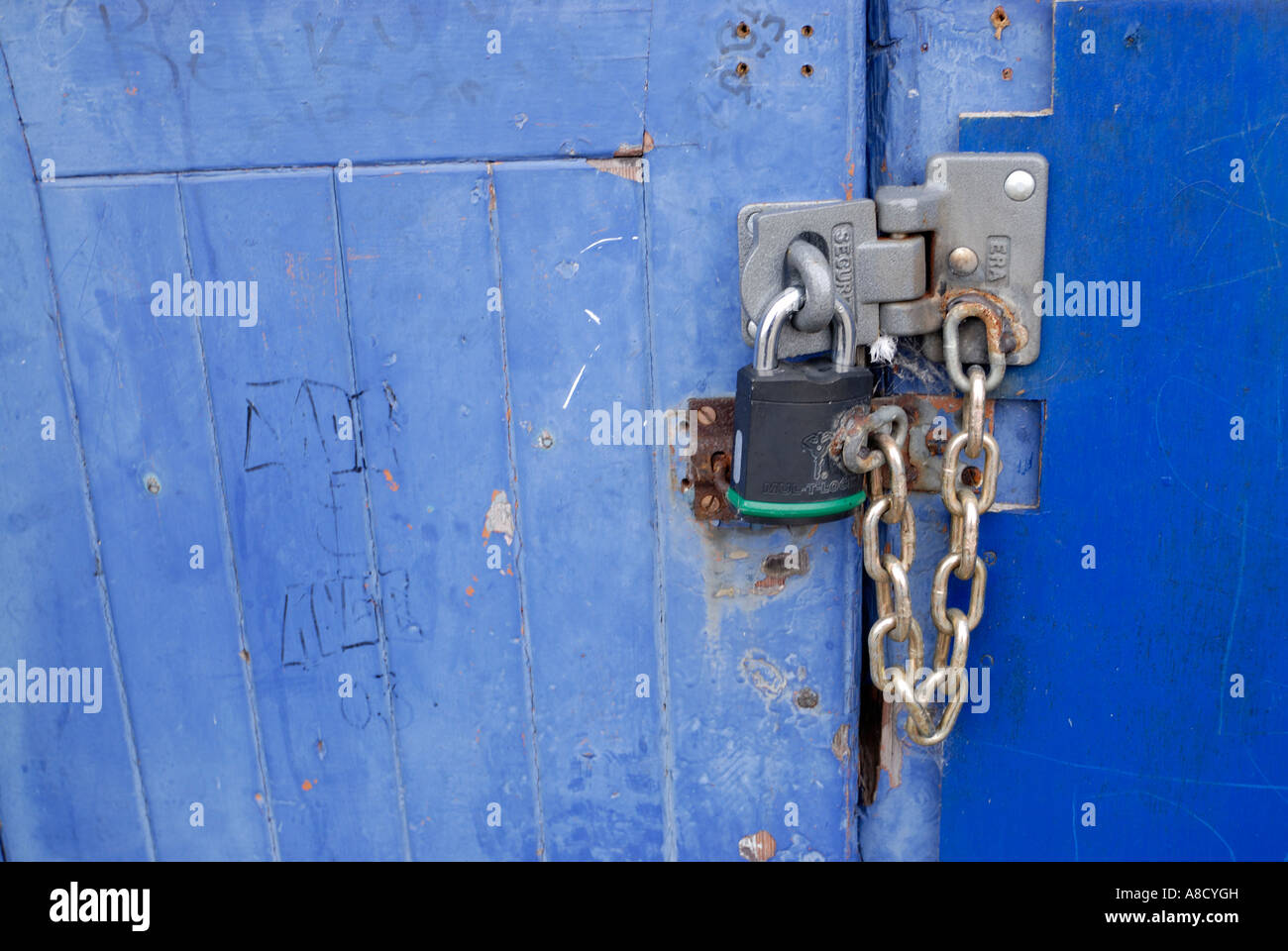 Lock and chain on blue doors Stock Photo