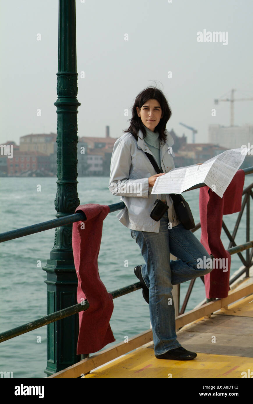 young lady reading a map in Venice Stock Photo