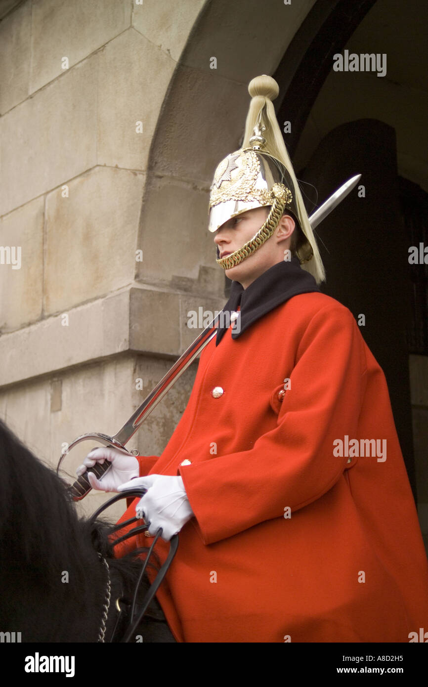 A mounted trooper of the Household Cavalry standing guard at the Whitehall entrance to Horse Guards Parade, London Stock Photo