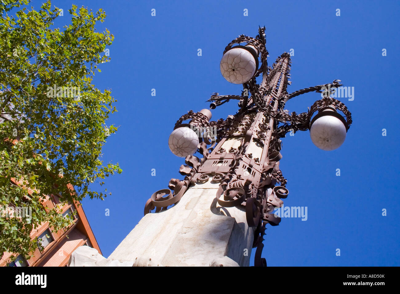 street lamp standard Barcelona Spain, bright sun blue sky Stock Photo